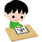タブレットで漢字を練習する子ども