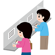 投票用紙に記入する人